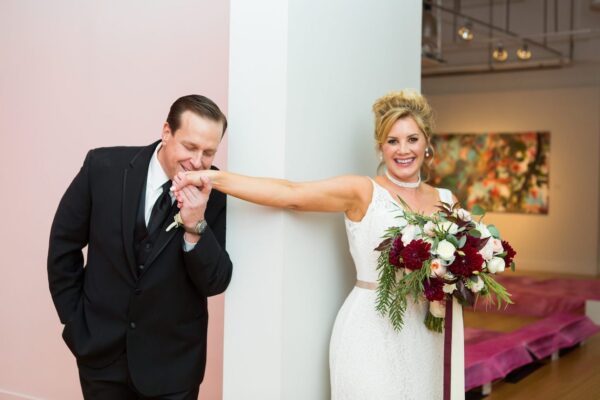 Groom-Kissing-Brides-Hand-Helen-Don-Photography-600x400